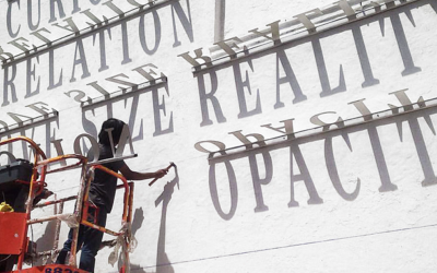 Typographic Shadow Graffiti Turns Boring Building Into Ever Changing Masterpiece
