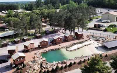 Cool off this summer at this tiny house water park with a natural lagoon